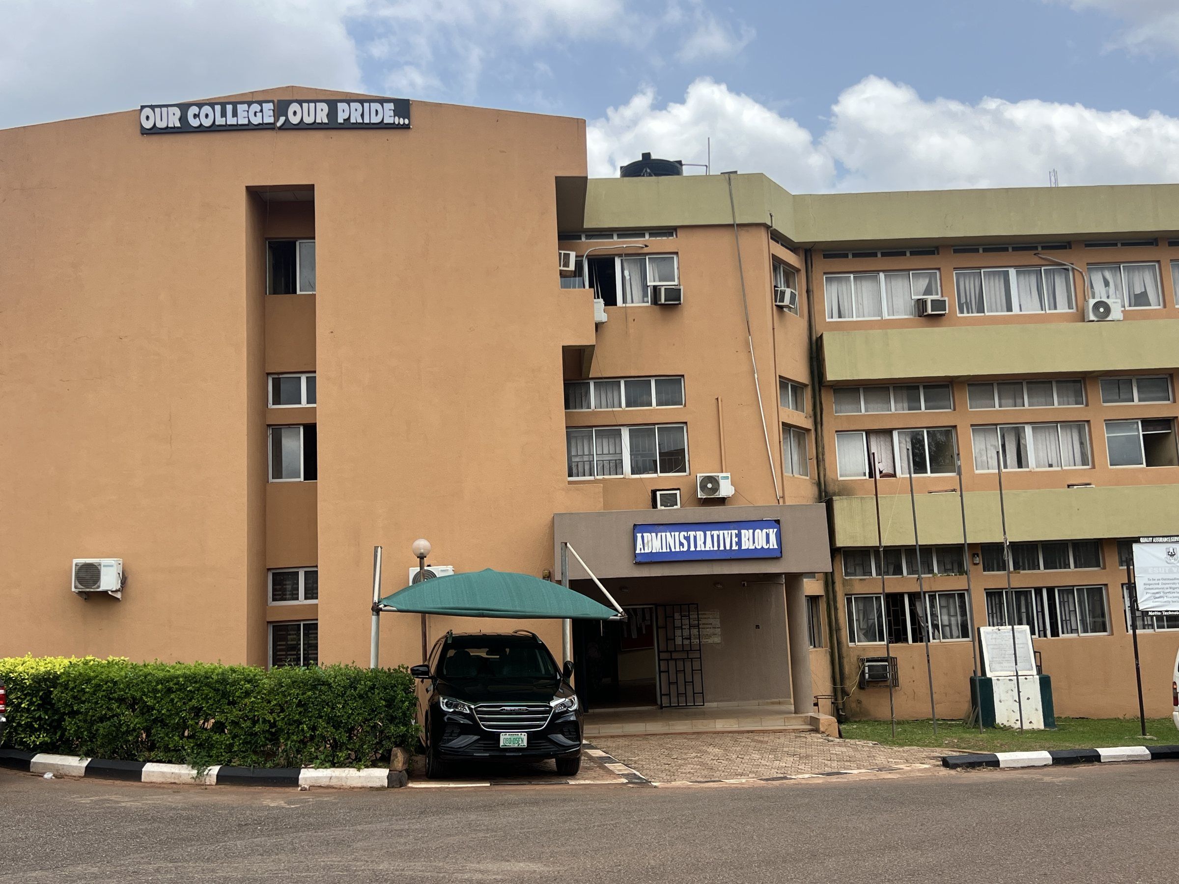 The Administrative Block, with a sign on the roof reading Our college, our pride.