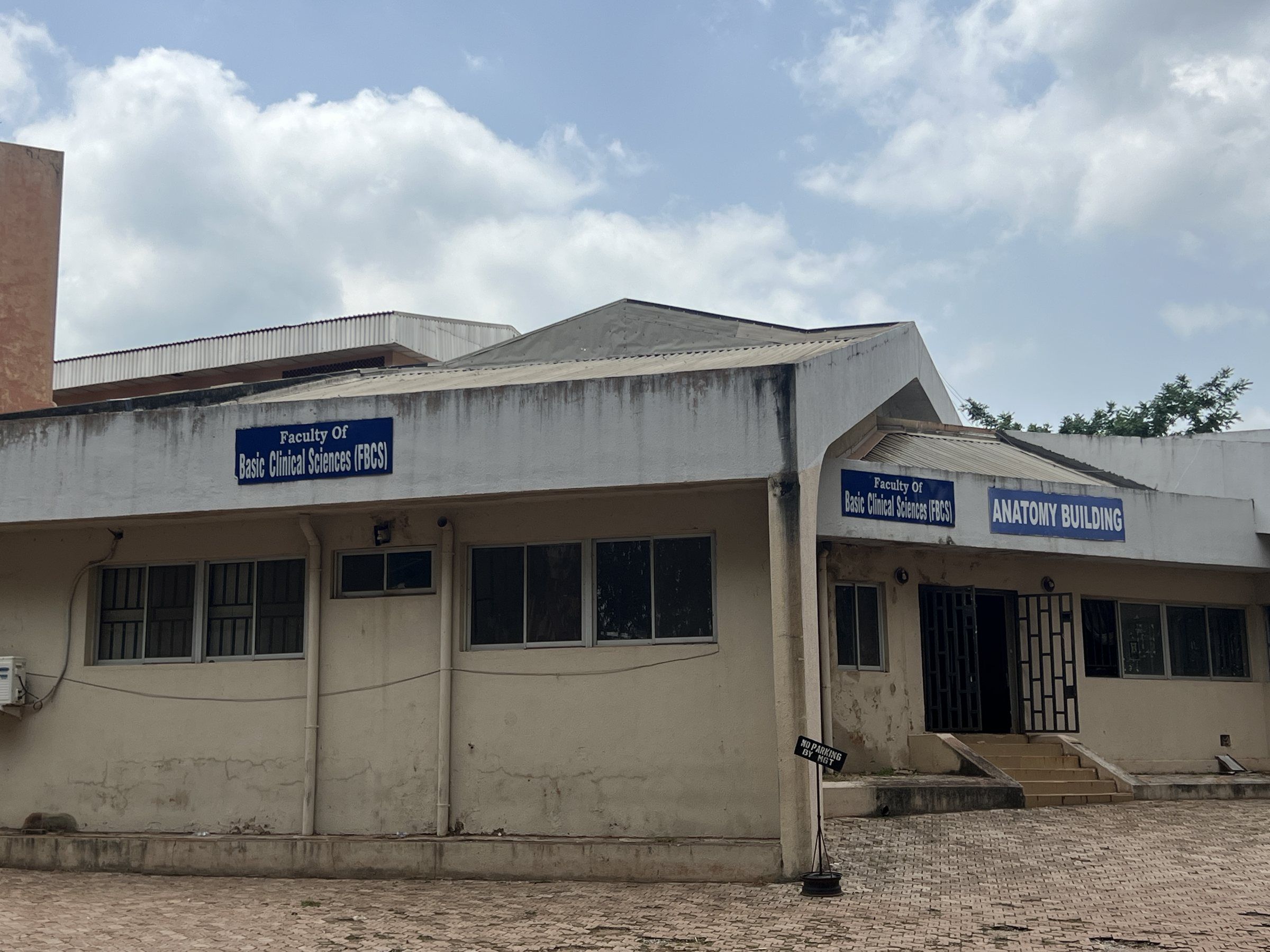 The single-storey Faculty of Basic Clinical Sciences building, with a sign for the Anatomy Building.
