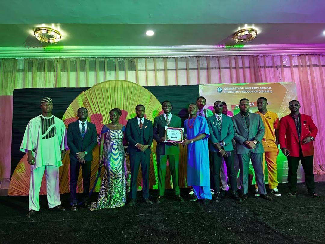 Award winners and guests in traditional and formal wear on the stage at the All Stars Awards and Dinner Night.